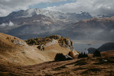 Scenic view of landscape and mountains against sky