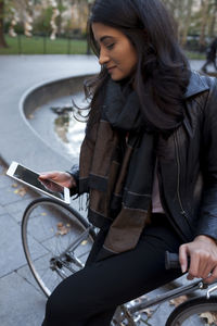 Portrait of a young woman in an urban park