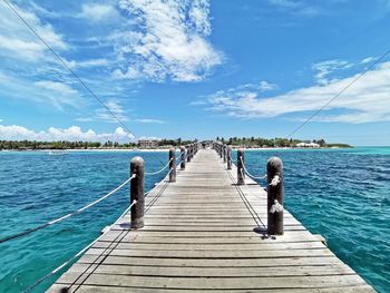 Pier over sea against sky