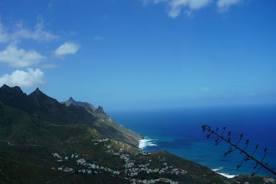 Scenic view of sea against blue sky