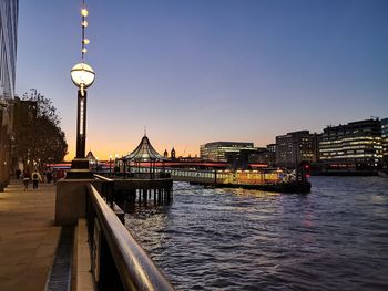 Bridge over river with buildings in background