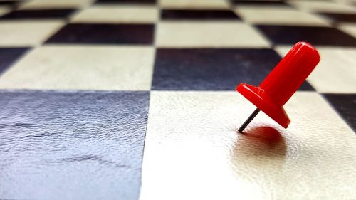 Close-up of red object on table