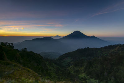 Scenic view of mountains against sky during sunset