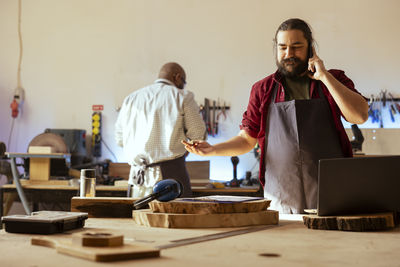 Portrait of young man working at table