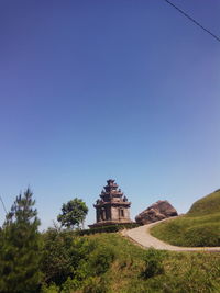 View of historical building against clear blue sky