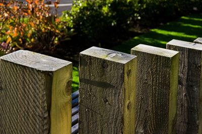 Close-up of wooden fence on field