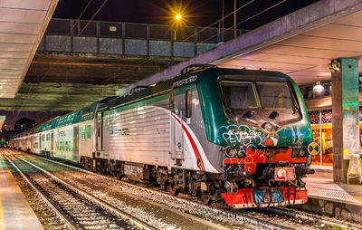 Train at railroad station at night