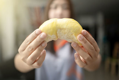 Close-up of hand holding leaf