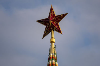 Low angle view of illuminated tower against sky