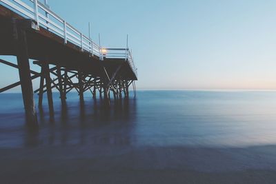 Pier over sea against sky