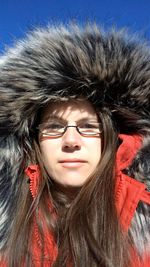 Portrait of young woman in snow