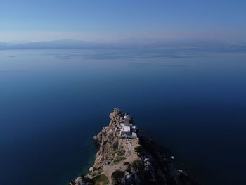 High angle view of rocks on sea against sky