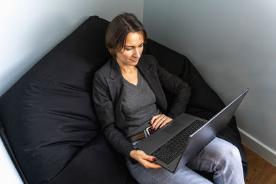 Young businesswoman using laptop