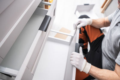 Midsection of man working at home