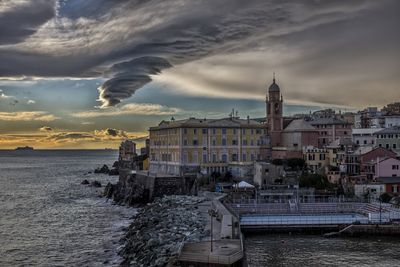 View of beach against cloudy sky