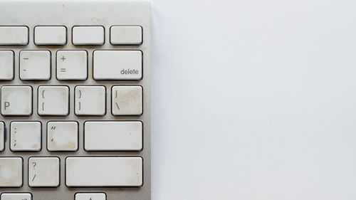 Close-up of computer keyboard on white background