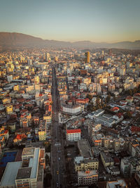 High angle view of city buildings against sky