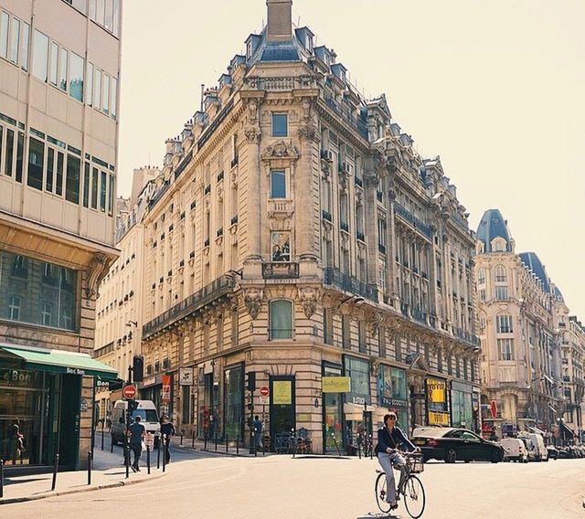 architecture, building exterior, built structure, bicycle, men, lifestyles, land vehicle, walking, transportation, street, leisure activity, person, full length, riding, mode of transport, city, city life, road