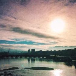 Scenic view of river at sunset