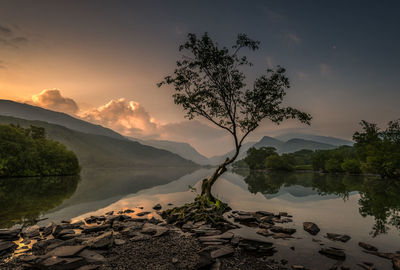 Scenic view of lake against sky during sunset