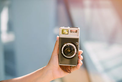 Close-up of hand holding camera