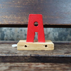 Close-up of wooden letter a on table