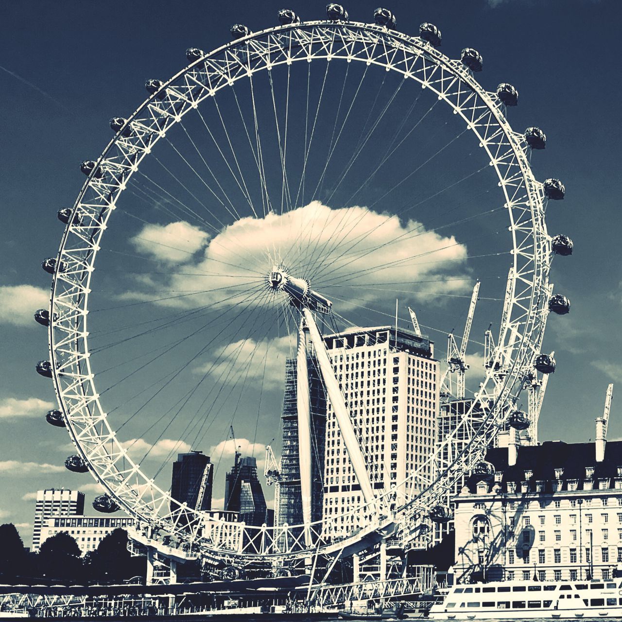 ferris wheel, amusement park, arts culture and entertainment, fairground ride, big wheel, fairground, amusement park ride, circle, sky, no people, low angle view, outdoors, leisure activity, day