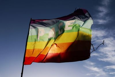 Low angle view of flag against sky