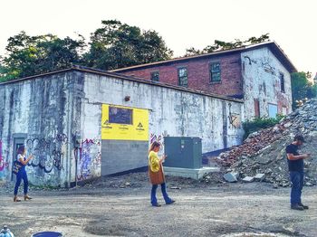 Full length of man standing against built structure