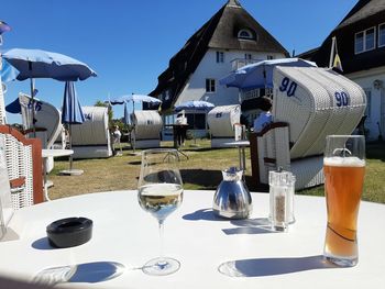 View of drink on table against built structures