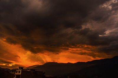 Scenic view of dramatic sky during sunset