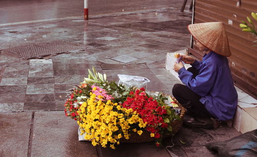 High angle view of woman holding flower bouquet