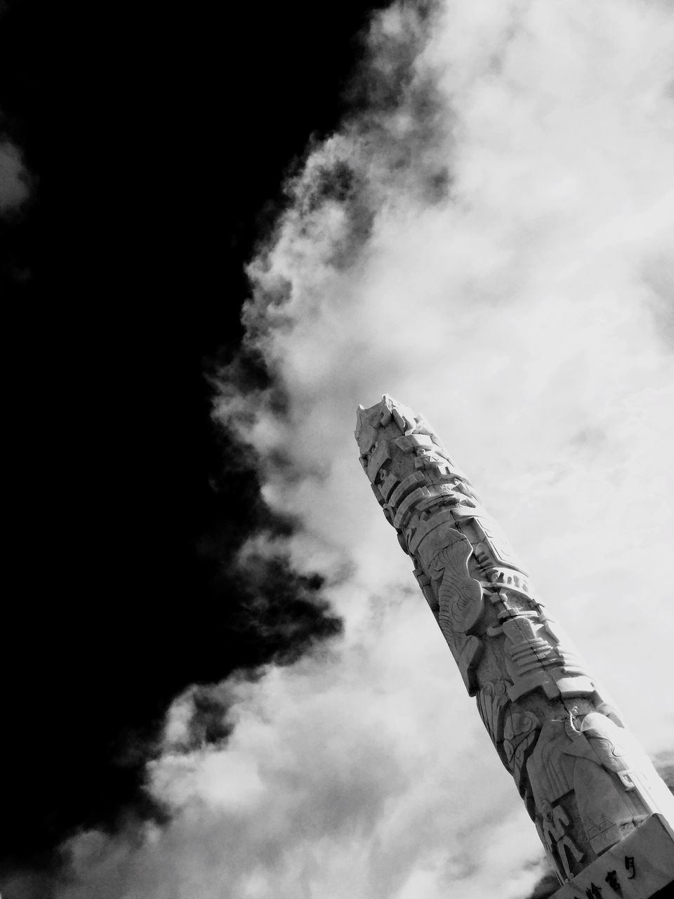 low angle view, sky, built structure, architecture, cloud - sky, cloudy, building exterior, tall - high, cloud, day, outdoors, tower, history, no people, overcast, high section, tall, famous place, architectural column, nature