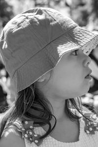 Close-up portrait of woman wearing hat