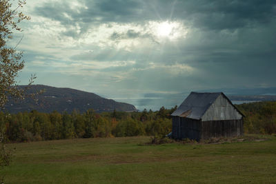 House on field against sky