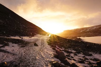 Scenic view of landscape against sky during sunset