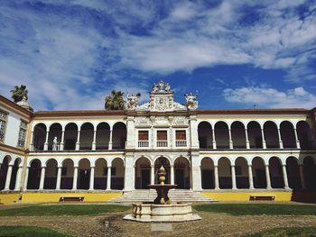 Facade of historical building against sky