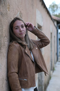 Portrait of young woman standing outdoors