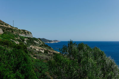 Scenic view of sea against clear blue sky
