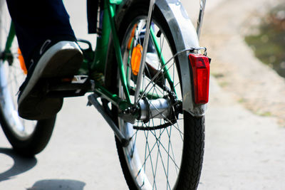 Low section of person on bicycle