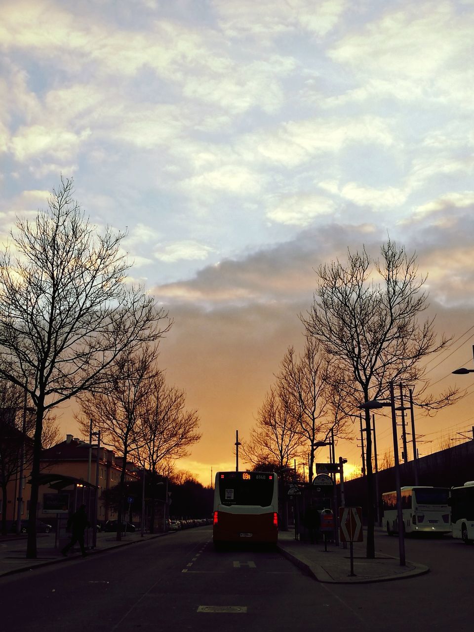 car, transportation, sky, mode of transport, sunset, land vehicle, tree, cloud - sky, road, no people, city, nature, outdoors, architecture, day