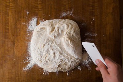 Close-up of person preparing food on table