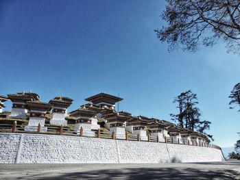 Low angle view of historical building against blue sky