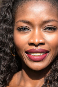 Close-up portrait of a smiling young woman