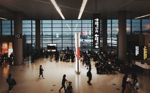 People walking in airport building