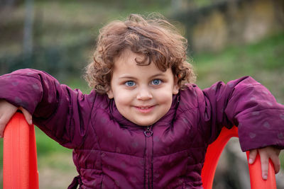 Portrait of young woman standing outdoors