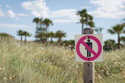 Close-up of signboard on field