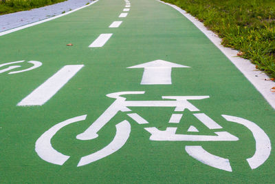 Arrow symbol and sign on bicycle lane