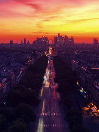 High angle view of illuminated buildings against sky during sunset