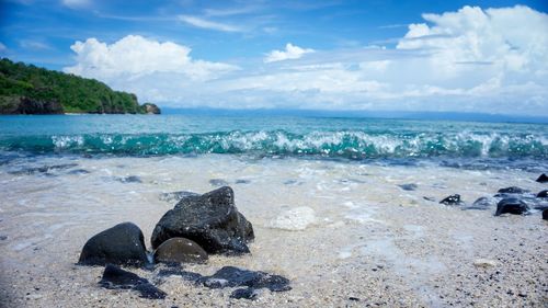 Scenic view of sea shore against sky